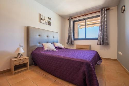 En eller flere senge i et værelse på Paraiso Pool and Sea View - TENESOL RENTALS
