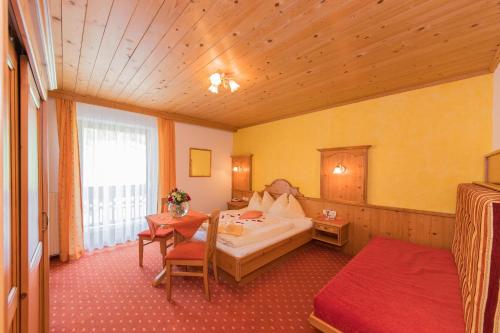 Postel nebo postele na pokoji v ubytování Landhotel Hinteraigengut