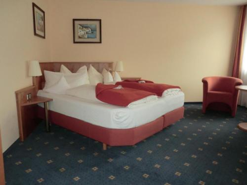 a hotel room with a bed in a room at Hotel Altenberg in Baden-Baden