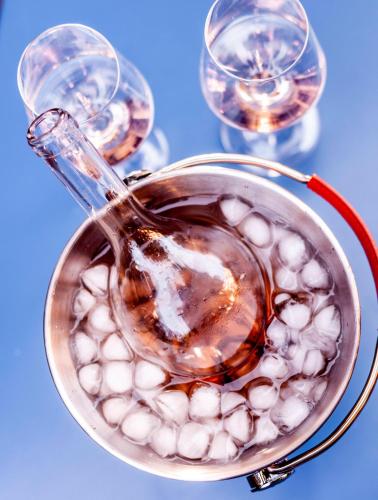 a glass pot with a spoon and three wine glasses at Hotel Birsighof Basel City Center in Basel