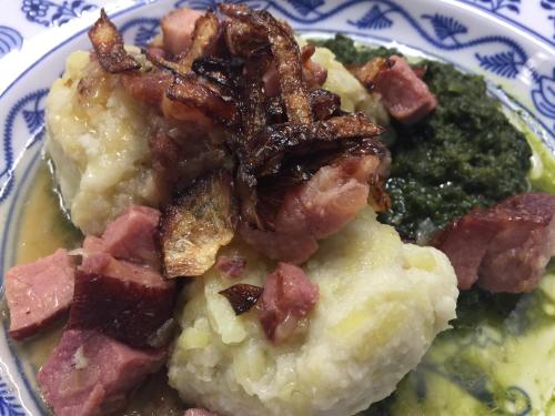 a plate of food with meat and potatoes and broccoli at Hotel Hromovka in Špindlerův Mlýn