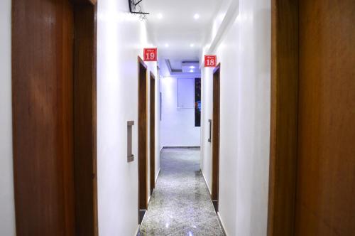 a hallway of a room with two doors and a hallwayngthngthngthngthngth at Hotel Gold in Sao Paulo