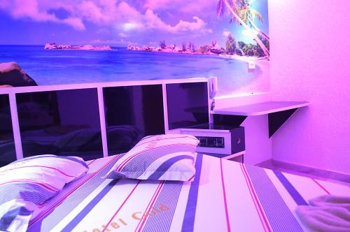 a room with a bed with a view of the beach at Hotel Gold in Sao Paulo