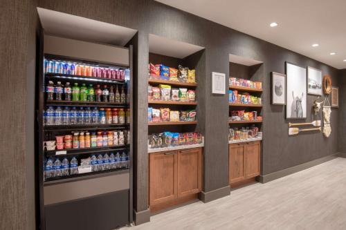 a store aisle with many bottles of soda at Hyatt Place Westminster Denver in Westminster
