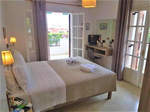 Postel nebo postele na pokoji v ubytování Stavroula Apartment