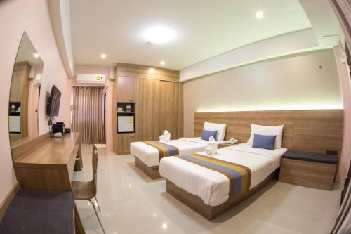 Postel nebo postele na pokoji v ubytování Unity Hotel