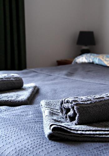 a close up of a bed with towels on it at Apartments Astoria HN in Herceg-Novi