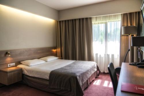 Postel nebo postele na pokoji v ubytování Hotel HP Park