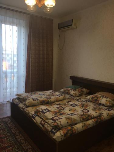 a bedroom with two beds and a window at Old Tiraspol Hostel in Tiraspol