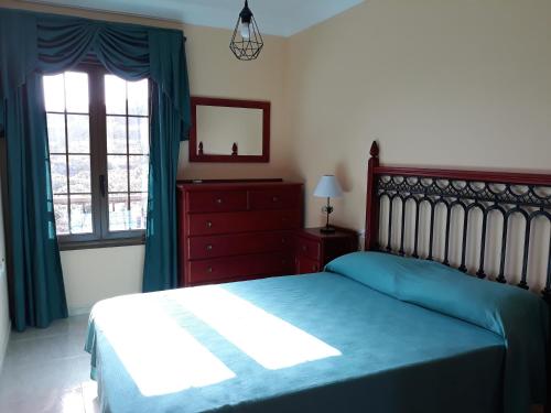 Un pat sau paturi într-o cameră la Casa Girdana