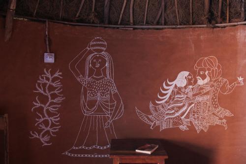 a wall with drawings on it in a room at Chhotaram Prajapat Home Stay in Jodhpur