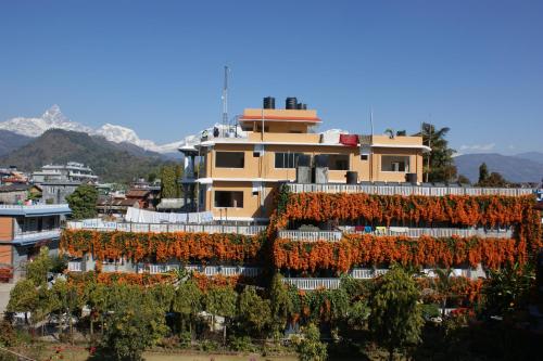 a building with flowers on the side of it at Hotel Yeti in Pokhara