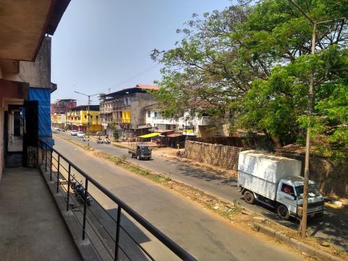 a white truck parked on the side of a street at Stay Goa Guesthouse in Madgaon