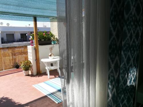 a view of a balcony with a table and a window at B&B La Terrazza Near The Beach in Bari