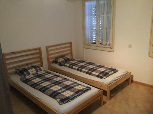 Postel nebo postele na pokoji v ubytování Tell Apartments Stans