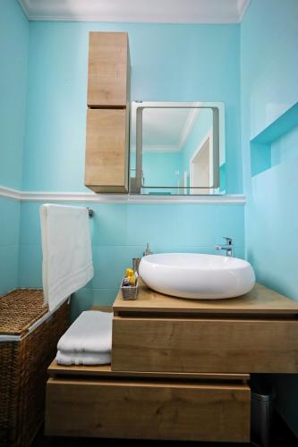 a bathroom with a sink and a mirror at Villa DOEL in Zadar