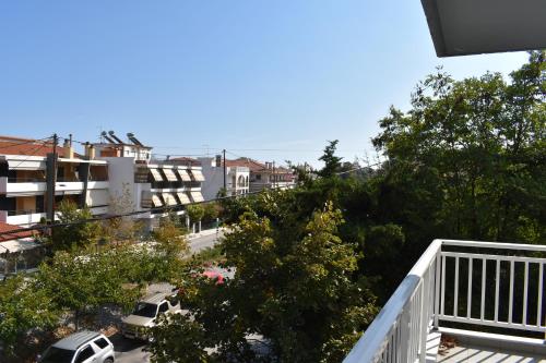 a view of a city street with cars parked at Galanis Studios and Apartments in Platamonas