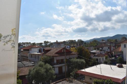 a view of a city with buildings and mountains at Galanis Studios and Apartments in Platamonas