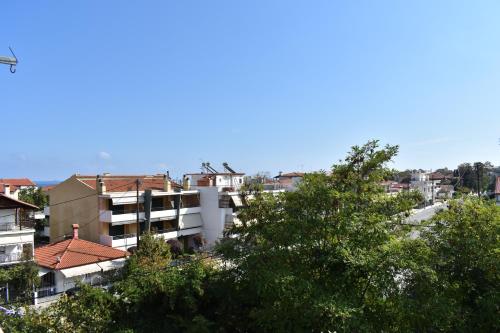 a view of a city with buildings and trees at Galanis Studios and Apartments in Platamonas
