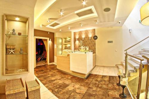 a large room with a staircase and a store at Hotel Zacisze in Turawa