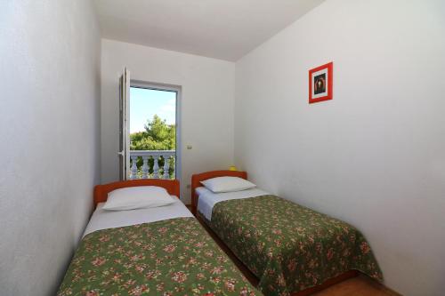Posteľ alebo postele v izbe v ubytovaní Apartments Slađana