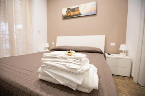 A bed or beds in a room at Marta House