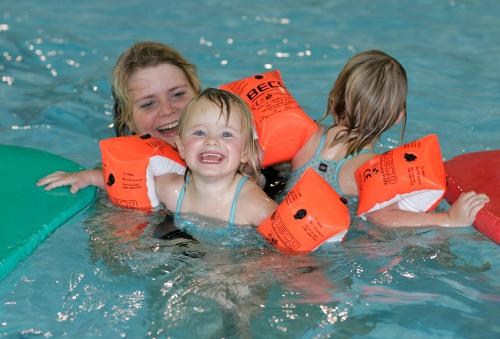 three children in the water in a pool at Skærbæk Holiday Center in Skærbæk