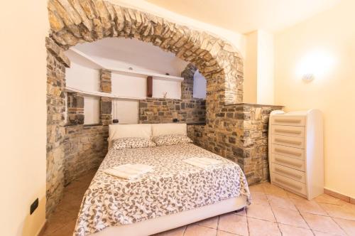 Posteľ alebo postele v izbe v ubytovaní Appartamenti Arco Antico