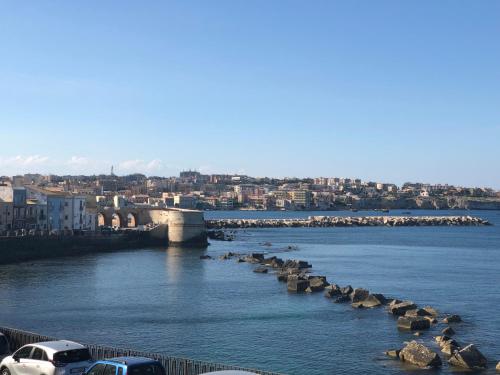 a large body of water with a bridge over it at Nettuno Suite in Syracuse