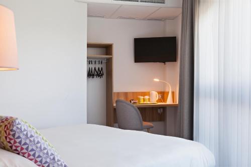 Postel nebo postele na pokoji v ubytování Campanile Metz Nord - Talange