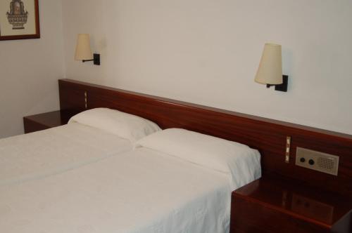 Postel nebo postele na pokoji v ubytování Hotel Betriu