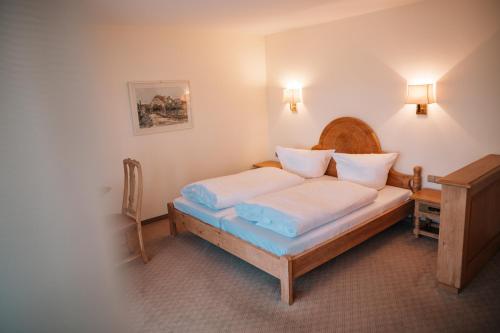 Postel nebo postele na pokoji v ubytování Meissmers Hotel