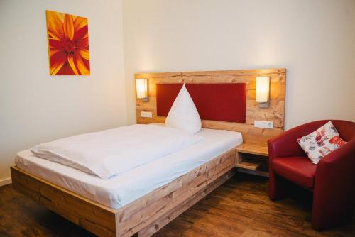 Säng eller sängar i ett rum på Gasthaus Stroh
