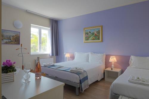 Postel nebo postele na pokoji v ubytování Albergo Trattoria Italia