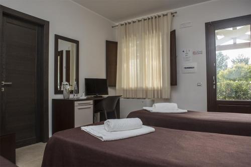 Katil atau katil-katil dalam bilik di Agriturismo Alpa