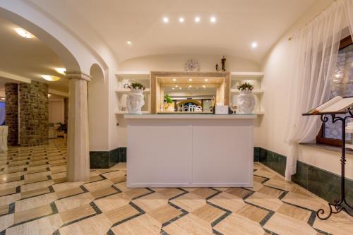a kitchen with a counter in a room at Romantic Relais Sorrento in Sorrento