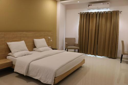 Katil atau katil-katil dalam bilik di Little Chef Hotel