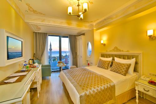A bed or beds in a room at Yılsam Sultanahmet Hotel