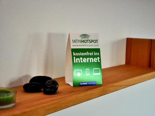 a box on a wooden counter with two black cookies at Haus Calmsailing in Börgerende-Rethwisch