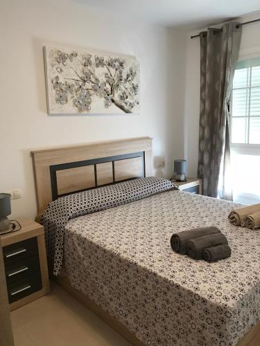 a bedroom with a bed with two pillows on it at Appartamento Erika in Gran Tarajal