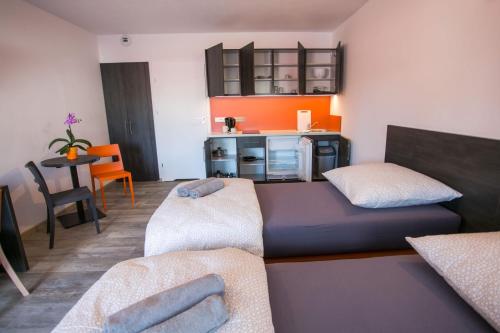 Postel nebo postele na pokoji v ubytování Apartments A7