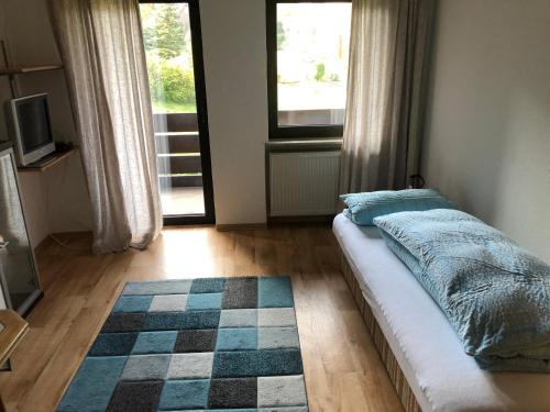 Ένα ή περισσότερα κρεβάτια σε δωμάτιο στο Zum waldfrieden