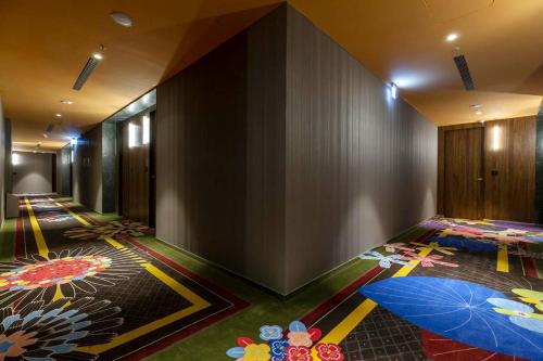 a hallway with umbrellas on the floor at Inhouse Hotel Grand in Taichung