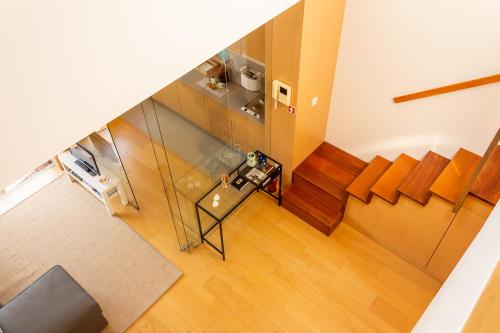 an overhead view of a living room with a table and chairs at Portus Vita Apartamento T0 Duplex in Vila Nova de Gaia