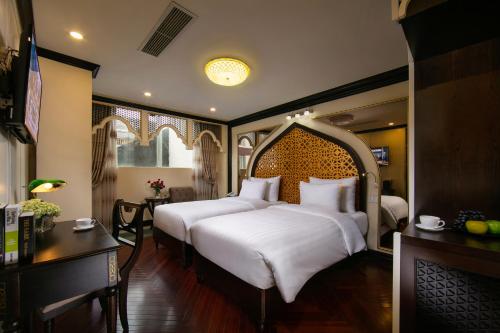 Giường trong phòng chung tại King Palace Hotel & Spa