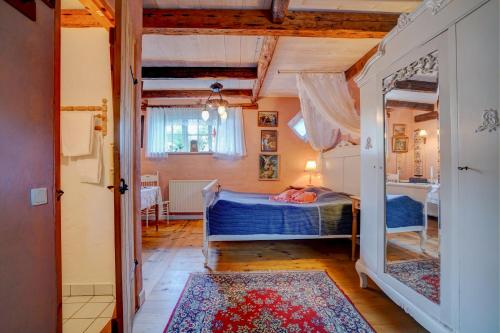 a small bedroom with a bed and a doorway at Svostrup Kro in Silkeborg