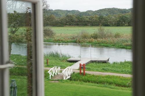 a view of a river from a window at Svostrup Kro in Silkeborg