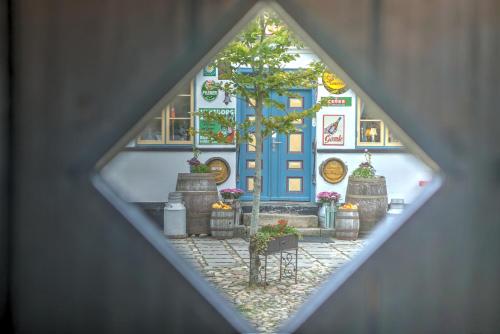 a view of a house with a blue door at Svostrup Kro in Silkeborg