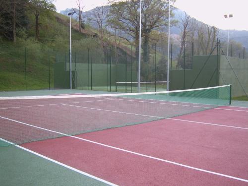 a tennis court with a net on top of it at Parador de Limpias in Limpias