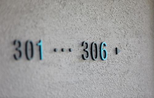 a close up of a wall with numbers on it at EBO Hotel Hangzhou Wulin - 5 mins drive to the West Lake in Hangzhou